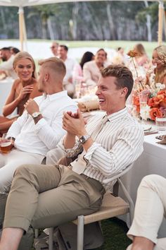 a man sitting at a table with other people