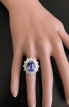 7.30 Carats Natural Very Nice Looking Tanzanite and Diamond 14K Solid White Gold Ring Suggested Replacement Value: Approx. $9,200.00 Total Natural Oval Cut Tanzanite Weight is: Approx. 5.50 Carats Tanzanite Measures: Approx. 12.80 x 9.40mm Natural Round Diamonds Weight: Approx. 1.80 Carats (color G-H / Clarity SI1-SI2) Ring total weight: Approx. 8.4 grams Disclaimer: all weights, measurements and colors are approximate and may vary slightly from the listed dimensions or as seen in the image. All Etsy Gold Ring, Tanzanite Ring, Natural Tanzanite, White Gold Ring, Quality Diamonds, White Gold Rings, Estate Jewelry, Oval Cut, Jewellery And Watches