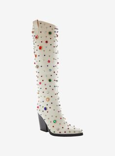 Bring some style to the wild west! These white boots feature a western-inspired rounded knee-high shaft  a pointed toe silhouette  a towering chunky heel  pull tabs  and an easy pull-on fit. Complete with opulent embellished detailing  consisting of assorted gemstones  faux pearl-adorned gold-tone hardware and sparkling rhinestone accents.Listed in women's sizes.Heel: 3 34''Polyurethane upper; rubber soleImported Painted Cowgirl Boots, Boots And Bling Gala, Eras Tour Shoes, White Boots Women, Bedazzled Boots, Gogo Boots Outfit, Chloe 2024, Fun Boots, Taylor Concert