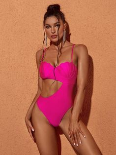 The Codi Cutout One Piece Swimsuit In Hot Pink is the perfect way to make a statement at the beach. Featuring adjustable spaghetti straps and a daring cutout, it's perfect for enjoying the sun while staying stylish. With a one piece design, you can enjoy a secure fit and all-day comfort.   Material: 100% Polyester  Stretch Factor:    Slight Stretch    Clean: Hand wash cold    Color may vary due to the lighting on images. The product images (without model) are the closest to the true color of the Cutout One Piece, One Piece Design, Fringe Mini Dress, Shapewear Tops, Jumpsuits And Romper, Pink Swimsuit, Feather Dress, Club Style, Enjoying The Sun