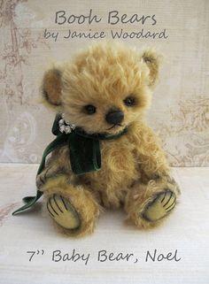 a brown teddy bear sitting on top of a table