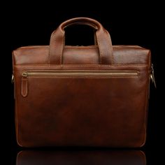 Made both for business and everyday life, our Essential modern briefcase has you feeling confident when carrying around everyday necessities like laptops, books, refreshments—you name it. Handcrafted in Florence, Italy by experienced craftsmen in family-owned studios, this briefcase is known for turning heads for all the right reasons. The irresistibly sleek design features full-grain cow leather with a solid brass hardware finish. On top of that, it is fully lined with fine cotton canvas. You'l Timeless Rectangular Laptop Bag For Daily Use, Luxury Rectangular Briefcase With Laptop Sleeve, Classic Brown Bags With Pen Slots, Brown Classic Bag With Pen Slots, Luxury Briefcase With Laptop Sleeve For Daily Use, Timeless Rectangular Briefcase For Daily Use, Rectangular Briefcase With Pen Slots For Everyday Use, Modern Brown Briefcase With Laptop Sleeve, Classic Briefcase With Laptop Sleeve