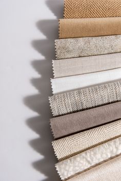 An array of Jamie Stern Fabrics in neutral colors ranging from gold and white to gray and cream. Sofa Fabric Texture, High End Residential, Fabric Store Design, Interior Design Fabric, Fabric Photography, Modern Sofa Designs, Textile Company, Furniture Catalog, Material Textures