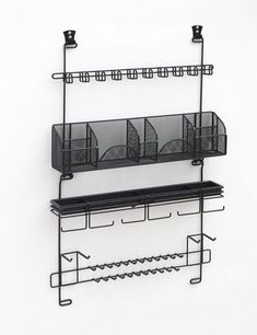 two metal shelves with wire baskets on them