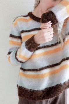 This colorful striped sweater is designed in a relax fit Featuring four cozy colors and a mohair-wool blend, it will warm up your winter. It's light and soft, with a fuzzy texture that's comfy on your skin. Style #: WSAH921 Brown Striped Sweater, Cozy Colors, Fuzzy Texture, Mohair Wool, Striped Sweater, Stripe Sweater, Winter Scarf, Your Skin, Wool Blend