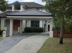 a large white house with a black roof