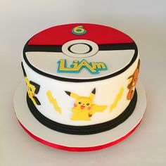 a pokemon themed birthday cake with pikachu and other characters