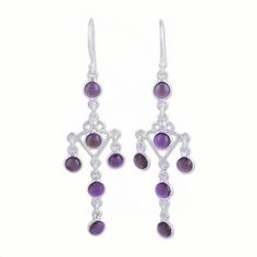 Twelve impressive stones of purple amethyst dangle from the ears in a pair of chandelier earrings presented by Parul. Local artisans handcraft the earrings using sterling silver with beautiful openwork to link the stones for a majestic addition to your wardrobe. Elegant Purple Dangle Chandelier Earrings, Elegant Purple Gemstone Chandelier Earrings, Silver Gemstone Chandelier Drop Earrings, Silver Gemstone Drop Chandelier Earrings, Handmade Purple Sterling Silver Chandelier Earrings, Purple Drop Chandelier Earrings As Gift, Elegant Amethyst Chandelier Earrings For Gift, Nickel-free Purple Dangle Chandelier Earrings, Handmade Amethyst Chandelier Earrings