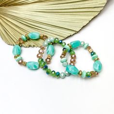 Set of Three | Coastal Charm Crystal and Marble Beaded Bracelet Set in Mint Green - Giddy Up Glamour Boutique Trendy Green Jewelry With Faceted Beads, Trendy Green Crystal Round Beads Bracelet, Trendy Green Crystal Bracelet With Round Beads, Elegant Green Stretch Bracelet With Colorful Beads, Trendy Green Beaded Crystal Bracelet, Giddy Up Glamour, Green Marble, Bracelet Set, Beaded Bracelet