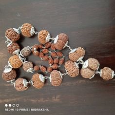 "Introducing the Siddha Mala, a powerful healing Rudraksha mala that can help you achieve success and prosperity in all areas of life. This divine mala is composed of various Rudraksha beads, each with its unique benefits. सर्वेषामपि वक्त्रणां धारणे यो समो भवेत् तस्मात्सर्व प्रयत्नेन रुद्राक्ष पुत्र धारय - पद्मपुराणे \"One who wears all mukhi Rudraksha becomes equal to me (Shiva). So dear Son, one should try by all means to wear all mukhi Rudraksha.\" -Padma Puran भक्तिश्रद्धायुतश्चैव सर्वकामार् Handmade Spiritual Mala For Puja, Handmade Mala For Diwali Meditation, Handmade Mala For Meditation And Diwali, Handmade Spiritual Mala For Diwali, Handmade Mala For Rituals And Festivals, Handmade Mala For Rituals, Hand-strung Spiritual Mala For Puja, Spiritual Handmade Mala For Diwali, Traditional Mala With Gemstone Beads For Healing