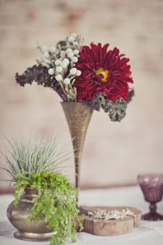 a vase filled with flowers sitting on top of a table