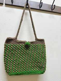 It is a double color crochet shoulder bag. It will be a great gift. Green Crochet Tote Straw Bag, Green Crochet Straw Tote Bag, Green Square Crochet Bag For Gift, Green Square Crochet Bag As Gift, Green Casual Crochet Bag Hand Knitted, Casual Green Hand Knitted Crochet Bag, Casual Green Hand-knitted Crochet Bag, Casual Green Crochet Bag, Green Crochet Bag For Daily Use