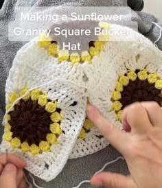 someone is making a sunflower granny square blocker hat