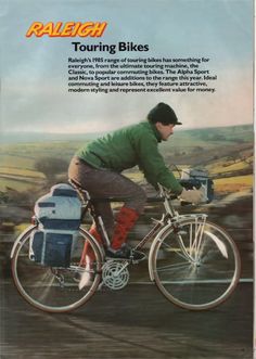 a man riding on the back of a bike next to a blue bag and backpack