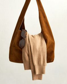 You've already got the cashmere crew and sunnies in your rotation, now it's time to level up your bag. Our Italian Suede Slouchy Shoulder Bag is giving timeless with its buttery-soft calf suede, elevated silhouette, and rich Whiskey hue. Always fairly priced at $119.90. Chic Suede Bag For On-the-go, Chic Suede Bag With Suede Lining, Chic Suede Hobo Bag With Soft Leather, Chic Suede Hobo Bag With Suede Lining, Chic Suede Hobo Bag With Removable Pouch, Chic Suede Hobo Bag With Leather Handles, Chic Suede Bags With Soft Leather, Chic Suede Hobo Bag For Everyday, Chic Soft Suede Hobo Bag