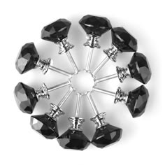 a bunch of black glass knobs sitting on top of each other