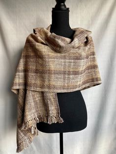 "Rustic High Desert wrap 22\" x 74\" including fringe Adorn yourself in art! Each unique hand woven piece is an expression of beauty. Some are squishy and cozy in a thick fabric. Some are delicate and light in a thinner fabric. My love has gone into each piece and I hope the recipient feels that love with an accessory that can last a lifetime and even be a family heirloom. These pieces store best either rolled up or hanging. Care instructions: Please hand wash in lukewarm water with light agitat Handwoven Brown Scarves For Fall, Beige Handwoven Bohemian Shawl, Brown Wool Bohemian Shawl, Woven Shawls, Bohemian Brown Handwoven Scarf, Brown Handwoven Winter Scarves, Hand Woven Blanket, Cream Tones, Cool Store