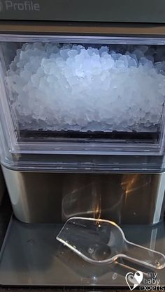 an ice machine is filled with chunks of ice