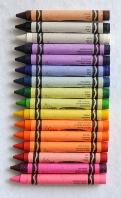 many different colored crayons are lined up together