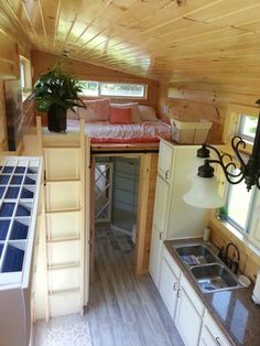 the interior of a tiny house with stairs