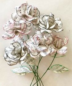 a bouquet of paper flowers with musical notes on them