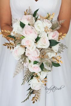 a bridal holding a bouquet of white and pink flowers