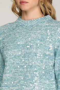 Get ready to sparkle and shine with our Long Sleeve Clear Sequin Sweater in a beautiful heather light blue! This sweater features long sleeves and clear sequins on the front, adding a touch of glam to any outfit. Stay cozy and stylish all season long with this must-have piece! 60% Polyester/30% Acrylic/10% Nylon Glitter Long Sleeve Winter Tops, Winter Glitter Long Sleeve Tops, Glitter Long Sleeve Tops For Winter, Long Sleeve Glitter Top For Winter, Long Sleeve Glitter Tops For Winter, Sequin Crew Neck Sweater, Casual Crew Neck Sweater With Sequins, Spring Long Sleeve Glitter Tops, Winter Contrast Sequin Tops