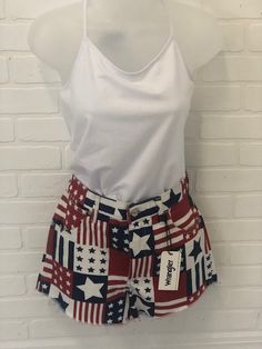 WRANGLER REWORKED SHORT Show your patriotic spirit by donning these Wrangler Flag Patriotic Shorts. Re-worked and featuring a frayed hem, these shorts are sure to turn heads as you show off your American pride! Show 'em how it's done with style and patriotism! 100% Cotton Western Boho, American Pride, Red White Blue, Red And White, High Rise, Flag, Turn Ons