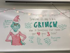 a white board with writing on it and an image of a grinch wearing a santa hat