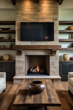 a living room filled with furniture and a flat screen tv mounted above a fire place