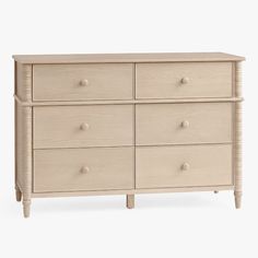 a white dresser with six drawers and two handles on each drawer, against a white background