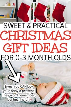 a baby laying on top of a bed next to stockings and christmas gifts for 3 month olds