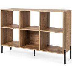 a wooden shelf with four compartments and black legs