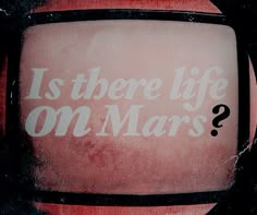 an old television with the words is there life on mars? written in white ink