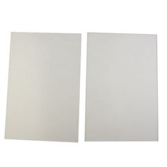 two pieces of white paper sitting next to each other on top of a white surface