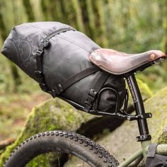 a close up of a bike with a bag on the back