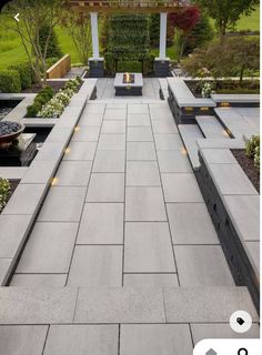 an outdoor patio with seating and landscaping