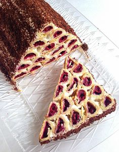 two slices of cake sitting on top of a glass plate