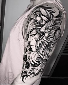 a man's half sleeve with an eagle and flowers tattoo on his left arm