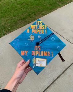 a blue graduation cap that says it's not just a paper its my diploma