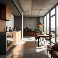 an open kitchen and dining room with large windows