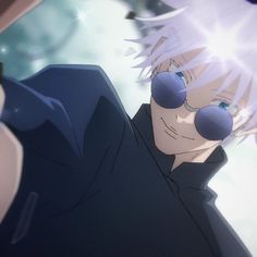 an anime character with white hair and blue eyes looking at his cell phone in front of him