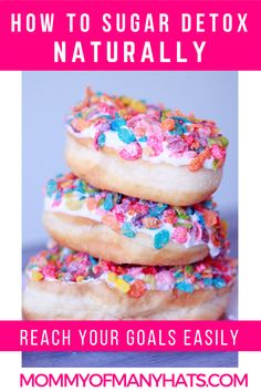 three donuts stacked on top of each other with sprinkles