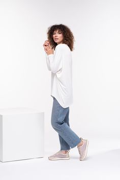 "Comfortable soft cotton viscose tunic with 3/4 sleeve and a loose design. Boat neckline and casual goth vibe - this tunic is perfect for your everyday style. The model in the picture is 176cm. ⅼ 5.8 ft. tall and is wearing size S / color: Off white 🌟 INFO: * Worldwide EXPRESS shipping - please provide a phone number for shipping documents * US Sizing XS to 4XL - body size chart available below * We offer customization to Personal Measurements & Larger Sizes 5XL, 6XL, 7XL .... 🌟 MATERIAL & White Relaxed Fit Rayon Blouse, Viscose Long Sleeve Tops For Daywear, Long Sleeve Viscose Tops For Daywear, White Relaxed Fit Rayon Top, White Rayon Tops With Relaxed Fit, White Rayon Top With Relaxed Fit, Casual Long Sleeve Rayon Tops, White Relaxed Fit Viscose Blouse, Oversized Viscose Casual Tops