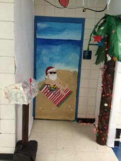 a door decorated to look like santa on the beach