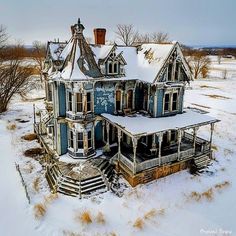 an old house with snow on the ground