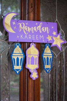 purple and gold rama decoration hanging on the front door