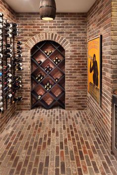 a wine cellar with brick walls and flooring