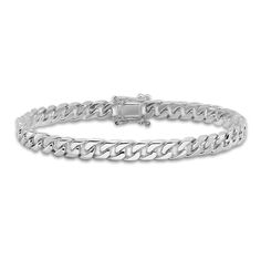 Versatile and stylish, bold solid curb links join together to form this handsome 6.8mm men's bracelet. Crafted in 14K white gold, the 8-inch curb chain secures in place with a box clasp. Classic White Gold Cuban Link Bracelet With Curb Chain, White Gold Cuban Link Bracelet With Solid Links, Classic White Gold Cuban Link Sterling Silver Bracelet, White Gold Cuban Link Bracelet, Classic Cuban Link Bracelet With Oval Links, Polished White Gold Cuban Link Bracelet, Modern Cuban Link Chain Bracelet, White Gold Cuban Link Bracelet With Solid Construction, White Gold Cuban Link Bracelet With Curb Chain