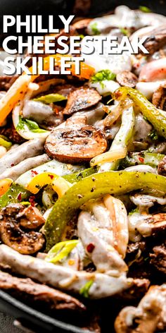 a skillet filled with shrimp, mushrooms and other vegetables on top of a table